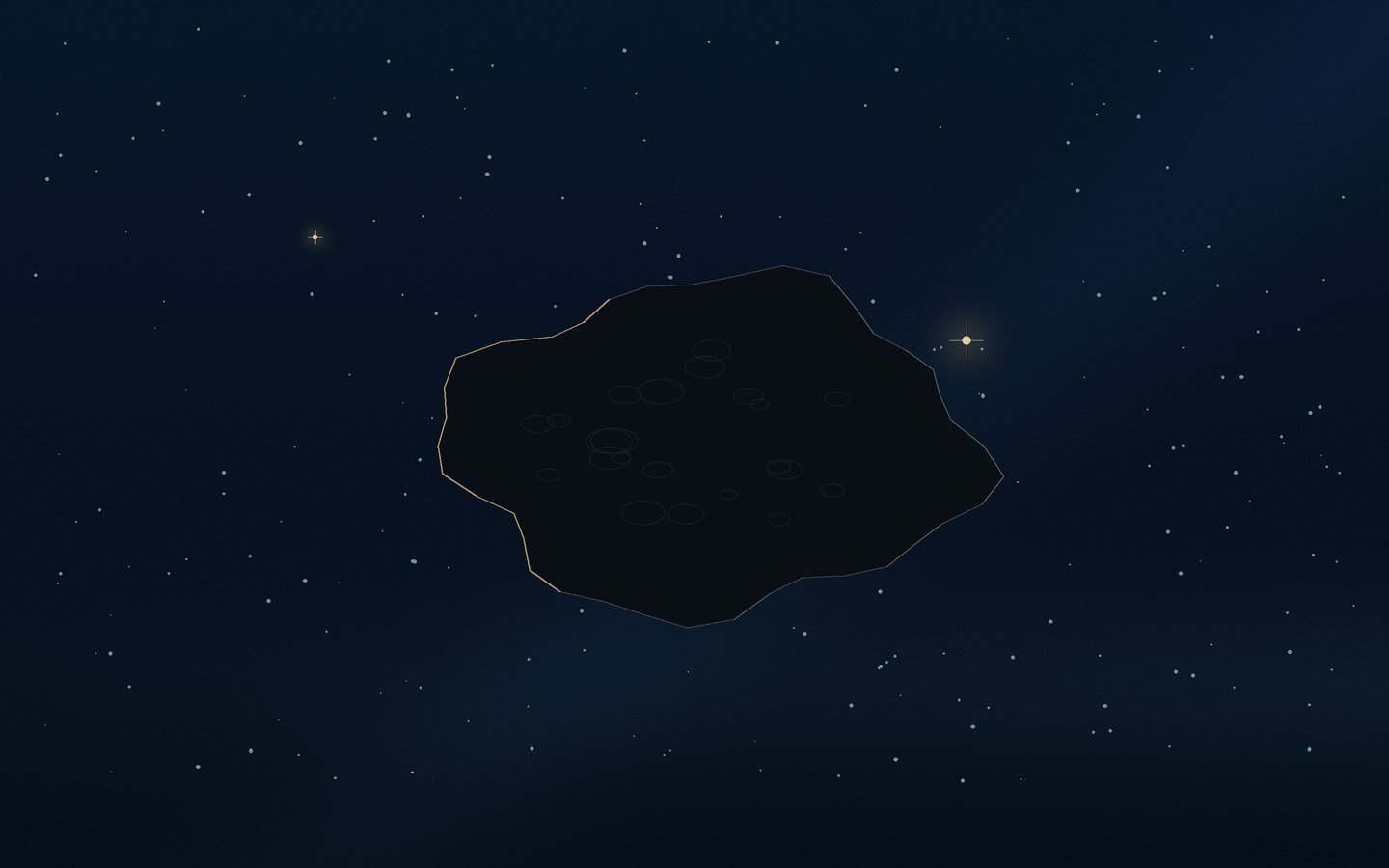 An irregular dark asteroid silhouette in front of a scattered star field