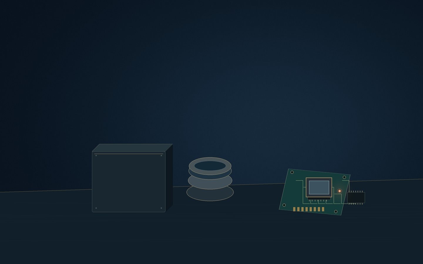 Small unmarked camera enclosure beside a lens and a sensor board
